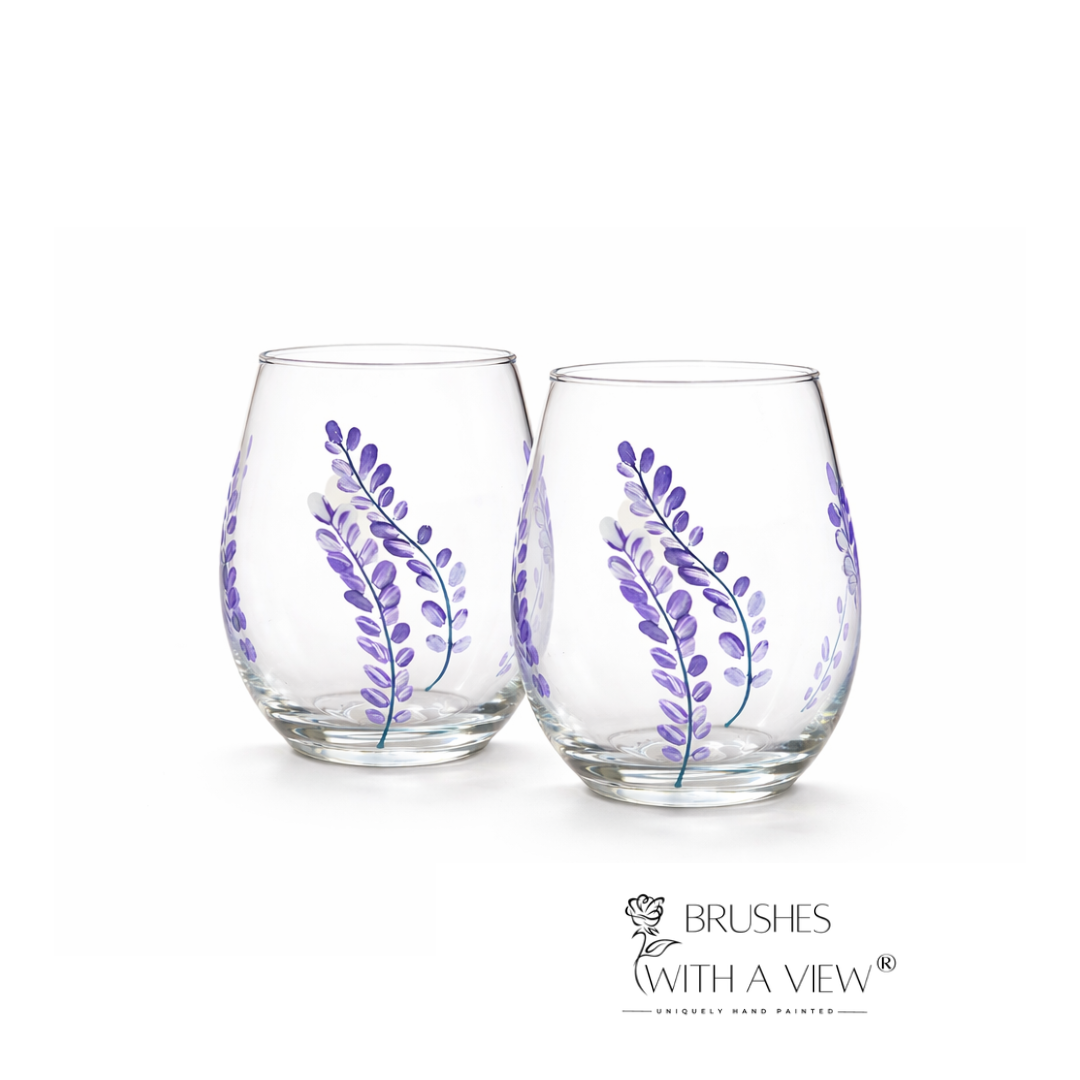 Two clear glass tumblers with purple leaf designs on a white background, branded 'Brushes with a View'.