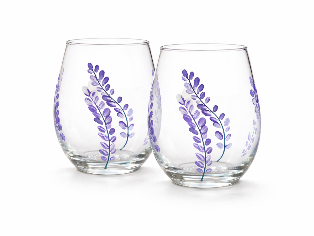 Two glass tumblers with purple floral designs on a white background