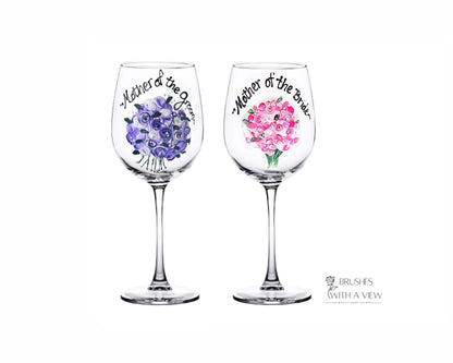 Two wine glasses with floral designs and text on a white background