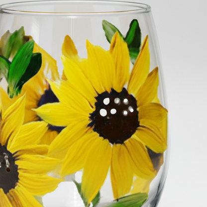 Clear glass with sunflower designs on a white background
